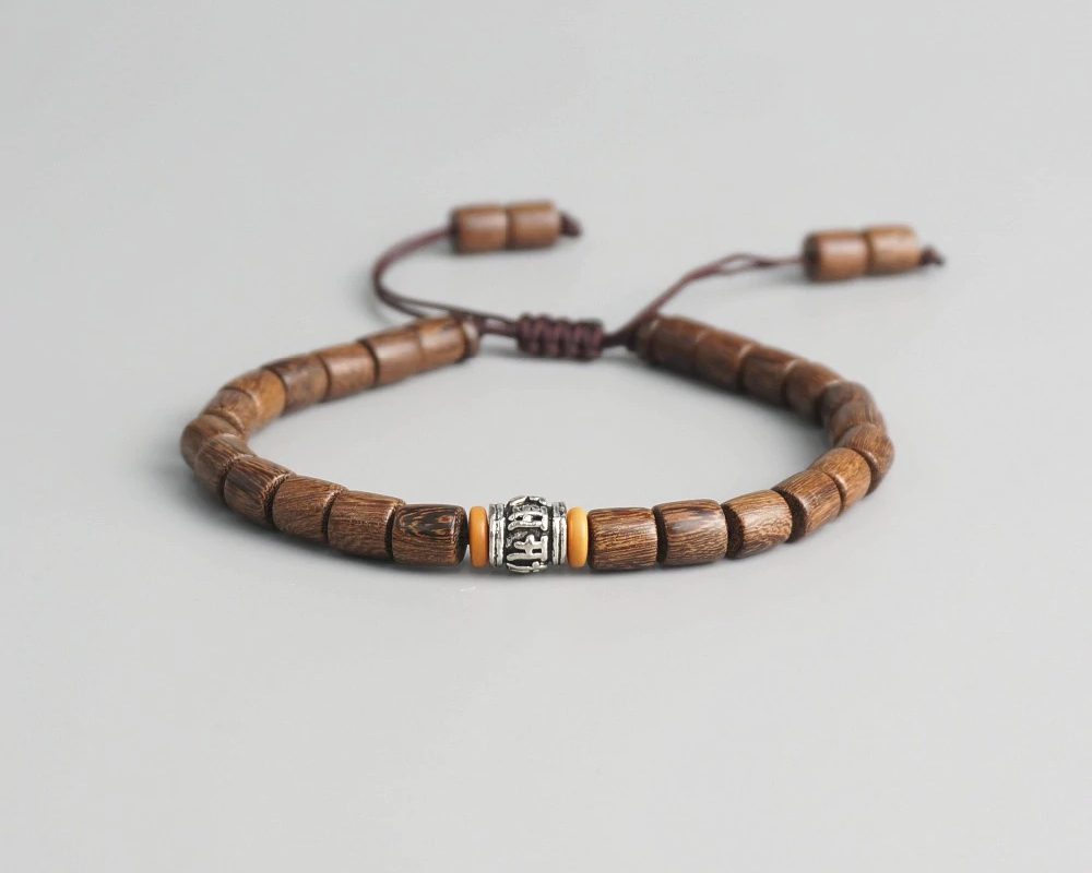 bracelet mala homme  perle de lave naturelles  espaceur argent tibetain  et bois 