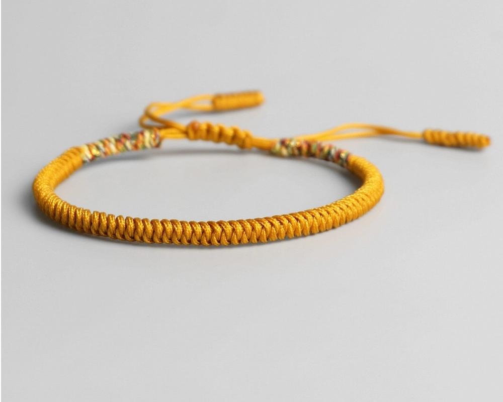 Bracelet bouddhiste tresse jaune et doré
